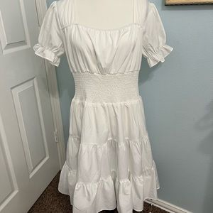 White dress with faltering waste.